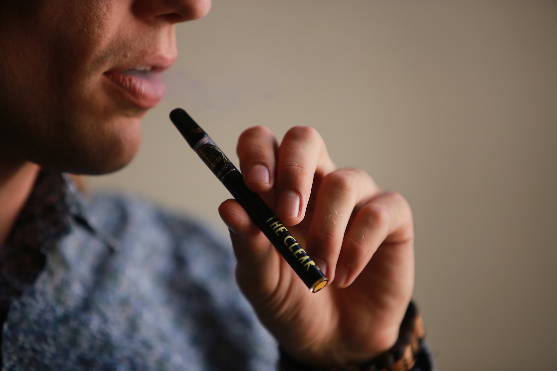 Man uses cannabis accessory to smoke